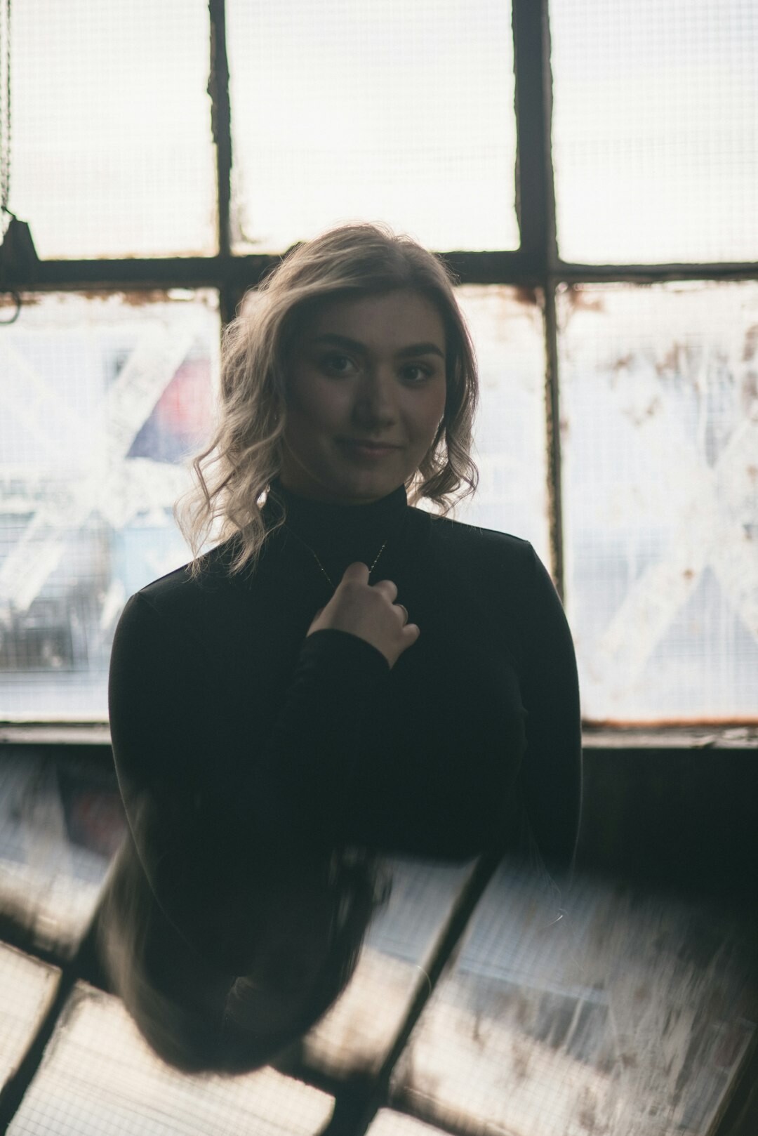 Studio portrait of a Swiss woman journalist with short brown hair